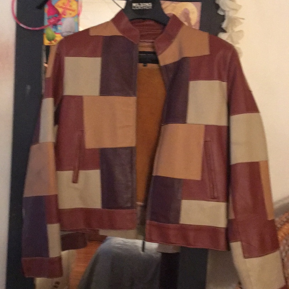 Leather patchwork jacket with zip out lining.